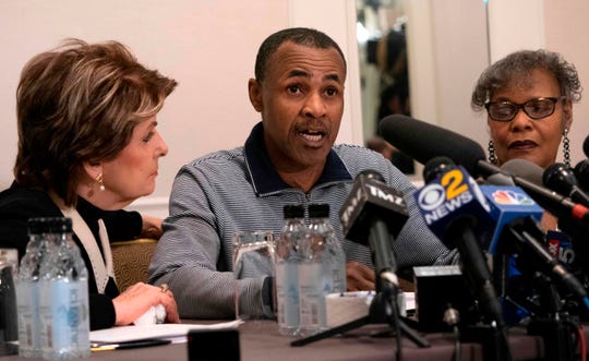 Gary Dennis speaks at a news conference along with attorney Gloria Allred, left, in New York. At right is Dennis' wife Sallie.