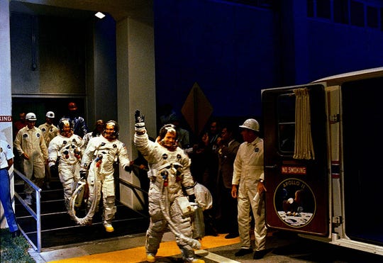 The Apollo 11 crew leaves the Kennedy Space Center manned spacecraft operations during the countdown to the launch. Mission Commander Neil Armstrong, command module pilot Michael Collins and lunar module pilot Buzz Aldrin prepare to board the special transport van to Launch Pad 39A, where their spacecraft is waiting for them.