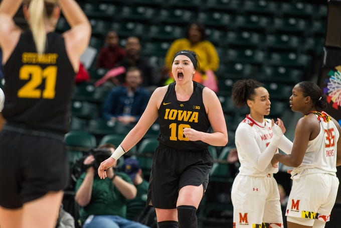 Iowa Hawkeyes forward Megan Gustafson (10) reacts to an and one play in the first half against the Maryland Terrapins in the women's Big Ten Conference Tournament at Bankers Life Fieldhouse.