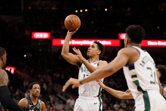 Bucks guard Malcolm Brogdon goes up for a shot against the Spurs during the first half Sunday.