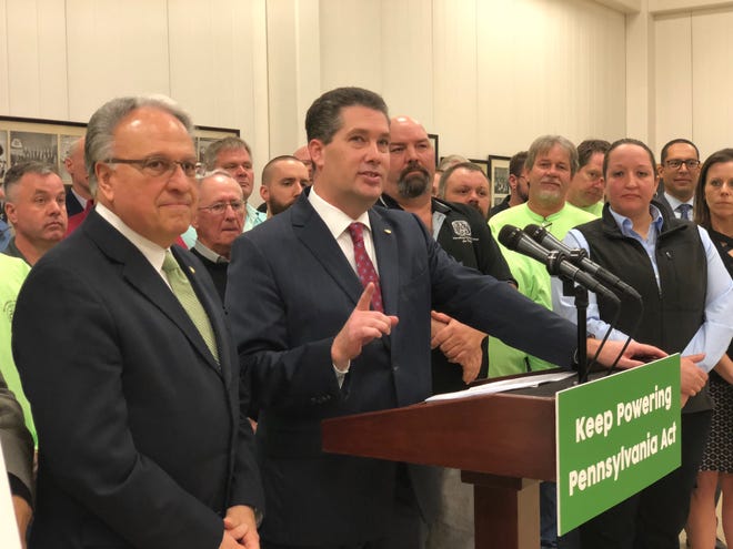 State Rep. Thomas Mehaffie, R-Dauphin County (at podium), introduced legislation Monday, March 11 that would effectively add nuclear energy into the Alternative Energy Portfolio Standards Act. (Photo by: Lindsay VanAsdalan)