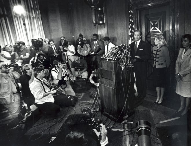 Sen. Joe Biden, with his wife Jill at his sides,  holds a press conference on Capitol Hill to announce his withdrawal from the presidential race on Sept. 23, 1987.
