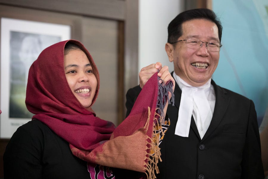 Indonesian Siti Aisyah, left, smiles with her lawyer Gooi Soon Seng after a press conference at Indonesian Embassy in Kuala Lumpur, Malaysia, on Monday.
