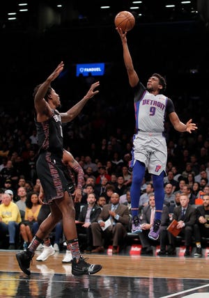 Detroit Pistons guard Langston Galloway puts up a shot against Brooklyn Nets forward Ed Davis during the first quarter Monday night.
