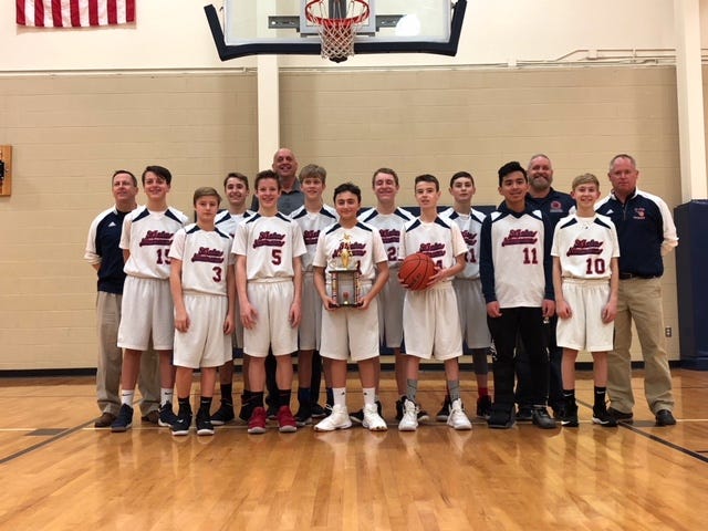 The Saint John Neumann boys basketball team won their division in 2019.