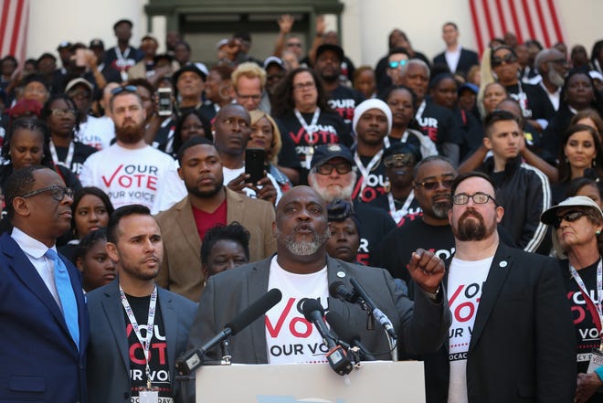Dezmond Meade, Florida Rights Restoration Coalition president, speaks in front of 500 Floridians with felony convictions whose voting rights were restored in November, as they gathered in the courtyard of the Capitol Tuesday before meeting with legislators to advocate for Amendment 4 legislation.