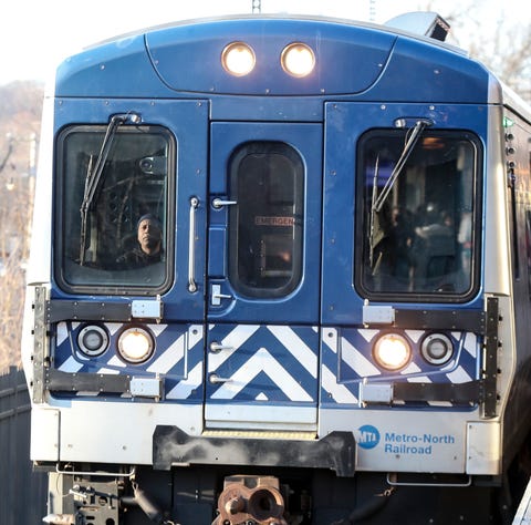 A MTA/Metro-North Railroad engineer drives a commu