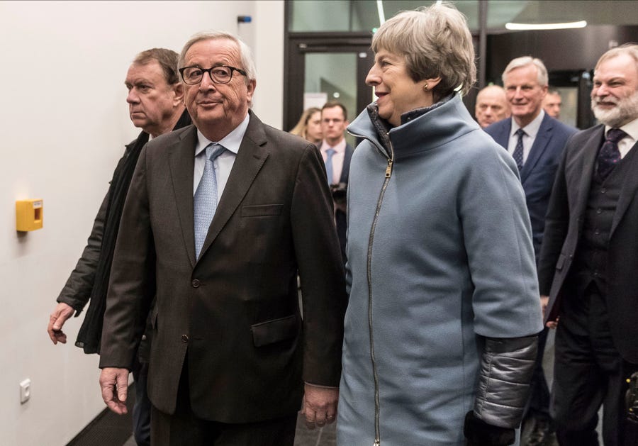 European Commission President Jean-Claude Juncke (left) welcomes Britain's Prime Minister Theresa May at the European Parliament in Strasbourg, eastern France, on Monday.