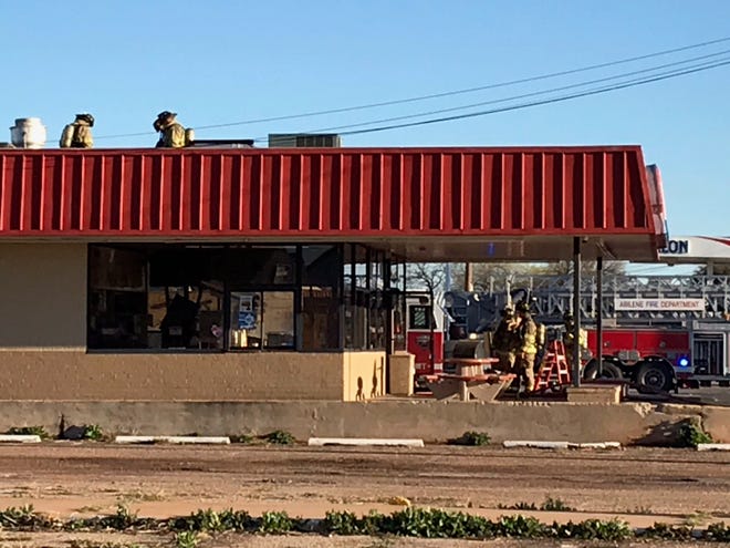Abilene firefighters are on the roof and inside a Dairy Queen at  942 N. Mockingbird Lane on Wednesday, March 13, 2019, after an overheated fryer caused heavy smoke.