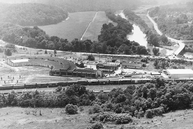 View of the Southern Railway, the roundhouse, and Carrier Bridge (Amboy Road) crossing the French Broad River to West Asheville.