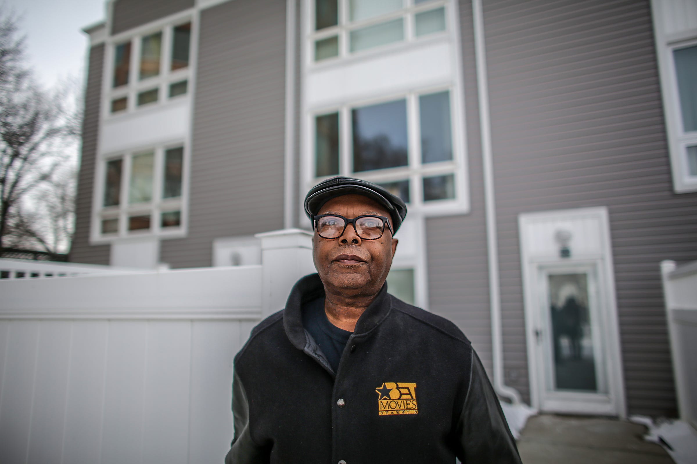 Freddie Alexander, 69, of Detroit stands in front of his former investment property that was acquired and sold by the Wayne County Land Bank because of delinquent taxes. He thought he was on a payment plan with the City of Detroit. Alexander is photographed in front of the condo on Thursday, Feb. 28, 2019.