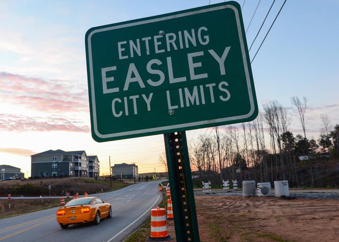 Ridge at Perry Bend housing, left, is just inside Easley near a future development, right, on Prince Perry Road in Easley Tuesday, March 12, 2019.