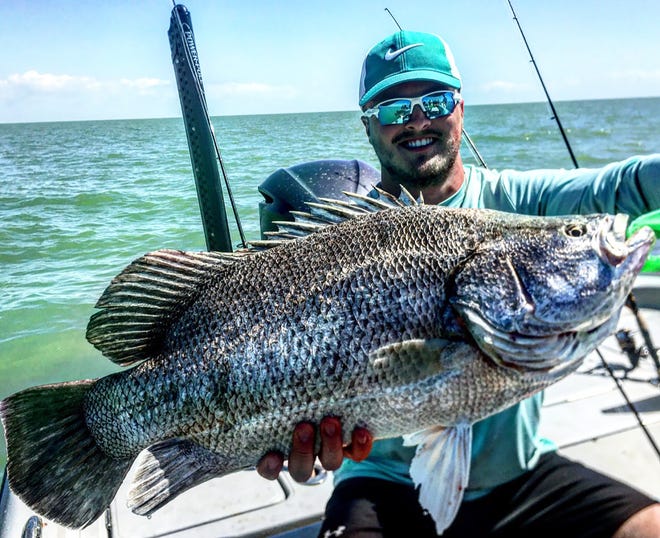 Kenny from South Dakota with a stud tripletail Fishing with Capt Christian sommer using squid.