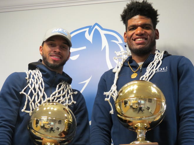 Seniors Darnell Edge (left) and Mike Holloway Jr. are all smiles after Fairleigh Dickinson won the Northeast Conference men's basketball title and a bid to the NCAA Tournament.