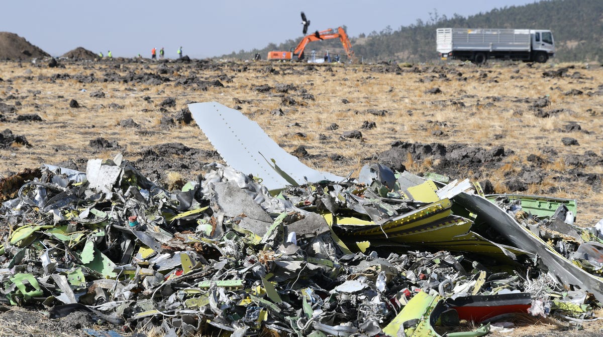 A heap of debris from the wreckage of an Ethiopia Airlines Boeing 737 Max 8 aircraft are piled at the crash site near Bishoftu, Ethiopia on March 13, 2019. Ethiopian Airlines flight ET 302 carrying 149 passengers and 8 crew was en route to Nairobi, Kenya, when it crashed on March 10, 2019 by yet undetermined reason. All passengers and crew aboard died in the crash. The Boeing 737 Max 8 aircraft has come under scrutiny after similar deadly crashes in Ethiopia and Indonesia   within a few months. Several countries have banned the plane type from their airspace and many airlines have grounded their 737 Max 8 planes for safety concerns after the Ethiopian Airlines plane crashed minutes after take-off on March 10. 