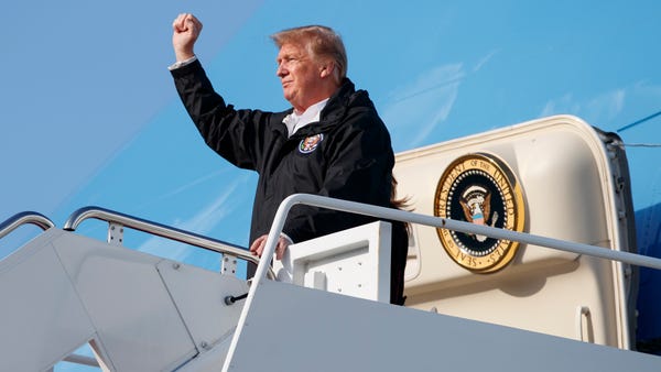 President Donald Trump gestures from Air Force...