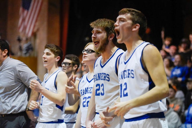 Drew Drageset (23) reacts with his teammates during No. 3 Lake Region's 
37-23 win over No. 7 Milton in a Division II semifinal at Barre 
Auditorium on Wednesday, March 13, 2019. The Rangers advance to their 
first state final since 2010 and face No. 1 Mt. St. Joseph on Saturday.
