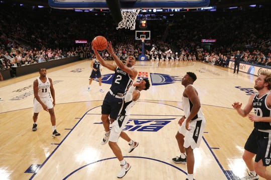 Mar 13, 2019; New York, NY, USA; Butler Bulldogs guard Aaron Thompson (2) drives to the basket against Providence Friars guard A.J. Reeves (10) during the first half of a first round game of the Big East conference tournament at Madison Square Garden.
