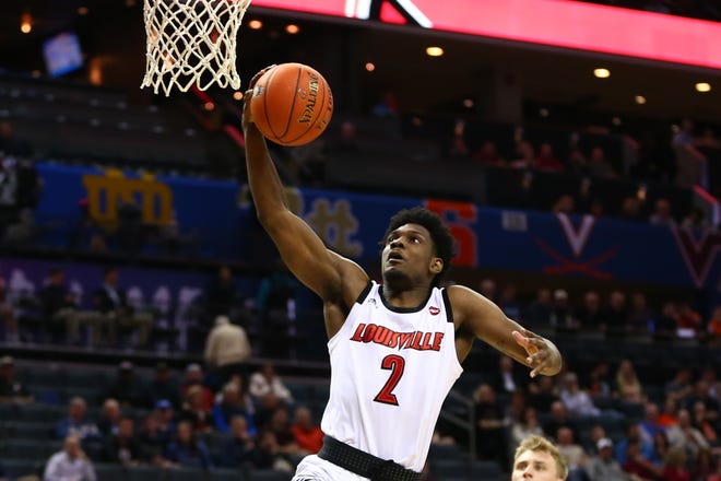 Louisville Cardinals guard Darius Perry (2) goes up for a shot against the Notre Dame Fighting Irish in the first half in the ACC conference tournament at Spectrum Center in Charlotte, North Carolina, on Wednesday, March 13, 2019.