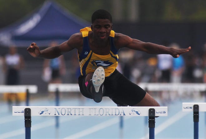 Rickards' Jabari Bryant clears a hurdle during last year's state meet. Bryant took second in the 300m high hurdles. This year, he's tops in his class and a top sprinter as well.