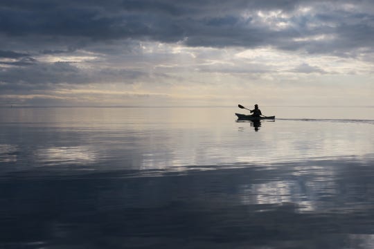 Dawn paddler along Piney Island near Panacea.