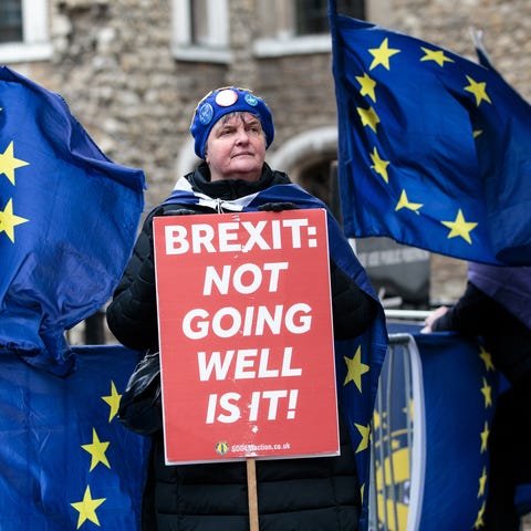 Anti-Brexit protesters demonstrate outside the...