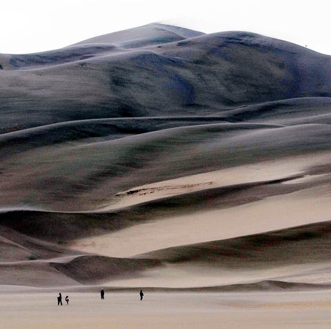 ** FILE ** Visitors to the Great Sand Dunes...