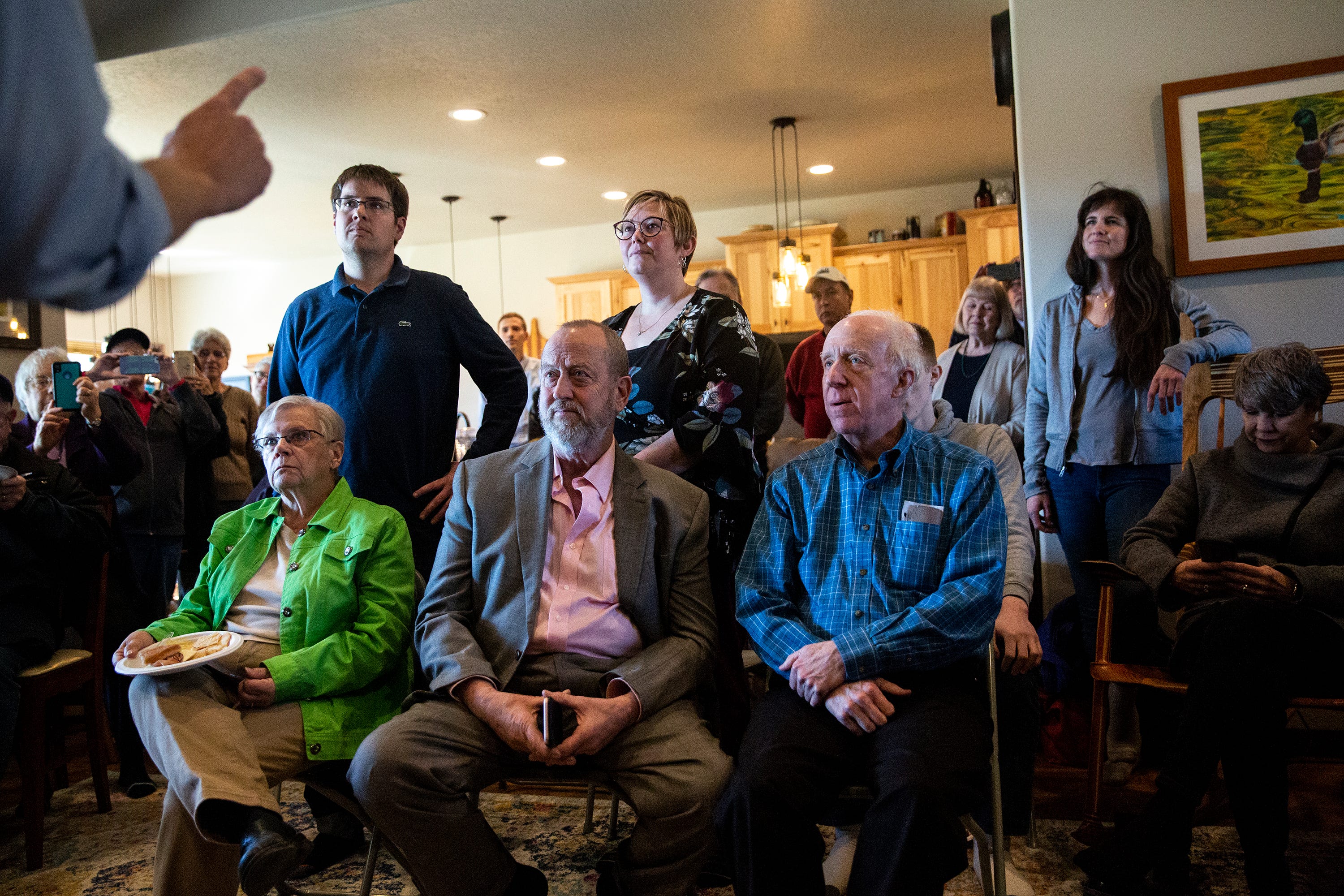 The crowd listens to Beto O'Rourke, Democratic candidate for president, at a house party on Friday, March 15, 2019, in Fairfield.