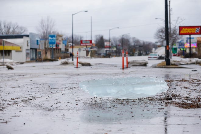 A large chunk of ice from the Fond du Lac River sits on Johnson Street Friday, March 15, 2019. Ice jams on the east branch of the Fond du Lac River and heavy rain caused widespread flooding problems in the city on Thursday the 14th. Doug Raflik/USA TODAY NETWORK-Wisconsin 