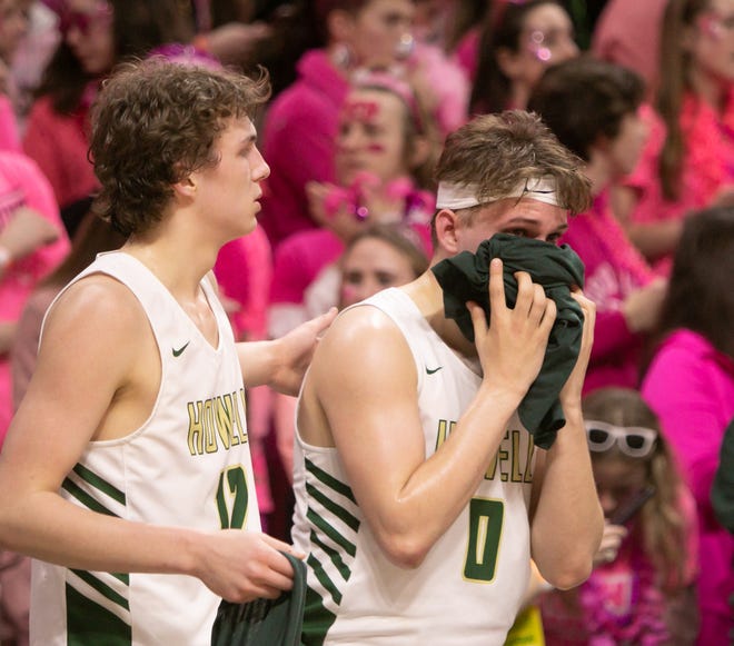 Howell's Josh Palo, right, and Tony Honkala react to a 72-56 loss to Ypsilanti Lincoln in a state Division 1 basketball semifinal at the Breslin Center on Friday, March 15, 2019.