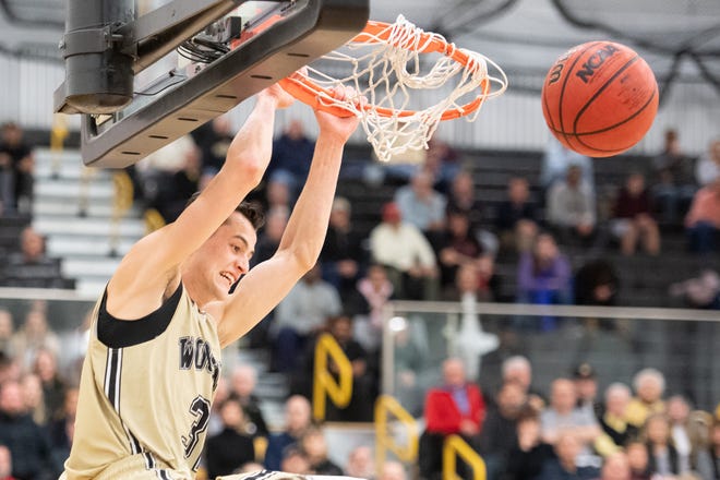 River Valley grad Danyon Hempy dunks the ball in a game for The College of Wooster during a game this season. Hempy averaged 20.6 points this year.