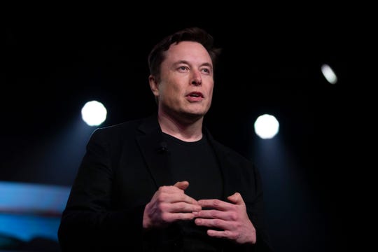 Tesla CEO Elon Musk speaks before unveiling the Model Y at the company's design studio Thursday, March 14, 2019, in Hawthorne, Calif. The Model Y may be Tesla's most important product yet as it attempts to expand into the mainstream and generate enough cash to repay massive debts that threaten to topple the Palo Alto, California, company. (AP Photo/Jae C. Hong)