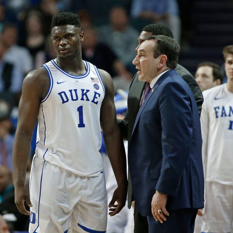Duke's Zion Williamson (1) talks with head coach...