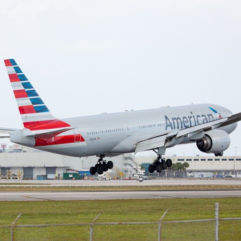 An American Airlines Boeing 777 lands at Miami Int