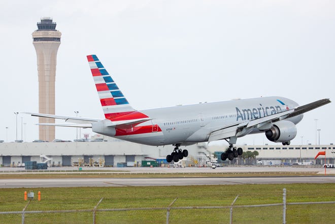 An American Airlines Boeing 777 lands at Miami International Airport on February 24, 2019.