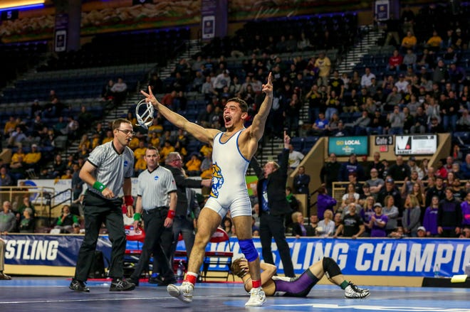 Jay Albis celebrates his second NCAA Division III wrestling title.