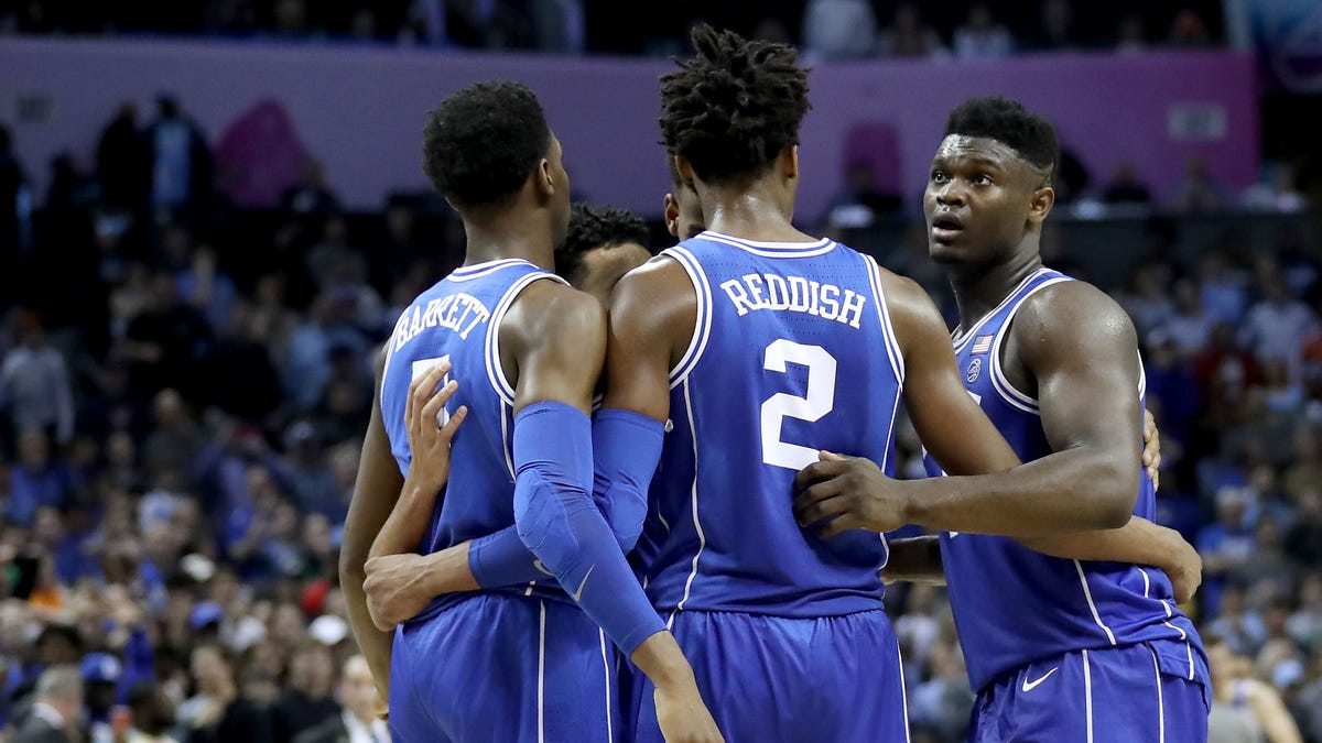 Duke's Zion Williamson, Cam Reddish and R.J. Barrett  huddle with teammates against the North Carolina Tar Heels in the ACC tournament.