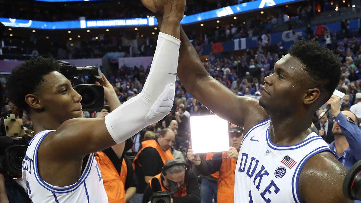 Duke Teammates RJ Barrett and Zion Williamson of the Duke Blue Devils react after defeating the Florida State Seminoles 73-63 in the championship game of the 2019 ACC Basketball Tournament.