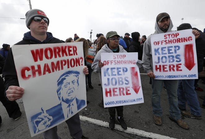 Workers protest March 6  outside GM's Lordstown, Ohio, plant, the last day of production at the factory. President Trump unleashed a Twitter storm about the plant before a Wednesday rally in Ohio.