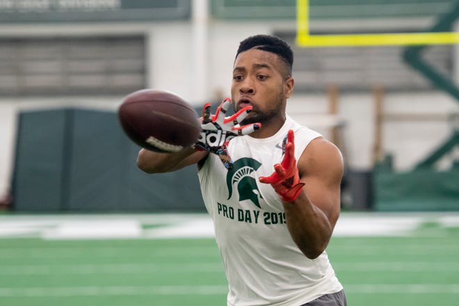 Michigan State safety Khari Willis catches a pass during an NFL pro day.