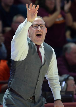 Virginia Tech men's basketball coach Buzz Williams gives instructions to his team during a Feb. 18 game against Virginia. Williams, a former CSU assistant coach, could meet up with another former CSU coach, Liberty's Ritchie McKay, in the second round of the NCAA tournament if both teams win their first-round games. Another former CSU coach, who worked with both McKay and Williams in Fort Collins, is in his first season as a special assistant to the head coach under Williams at Virginia Tech.