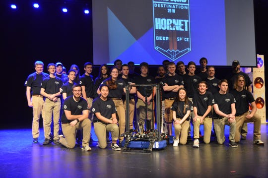 The Mountain Home High School Bomb Squad robotics team poses for a picture at the Rocket City Regionals in Alabama. The team took home a second place overall finish and also took home the Engineering Award for overall best design of a robot.