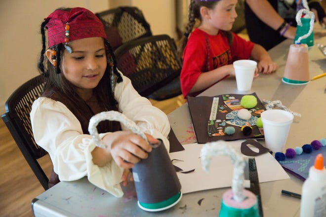 In this file photo, Isabella Montoya, 8, dressed as Captain Jack Sparrow from "Pirates of the Caribbean," puts the finishing touches on her pirate hook during a spring break camp, put on by the city of Las Cruces Friday, March 24, 2017, at the Branigan Cultural Center.