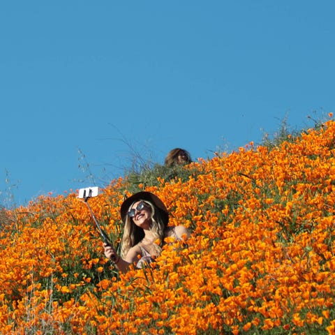 A woman takes a selfie in Walker Canyon in Lake...