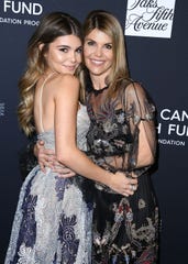 Lori Loughlin with her daughter Olivia Jade Giannulli at the Gala An unforgettable evening for the Women's Cancer Research Fund on February 27, 2018 in Beverly Hills, California.