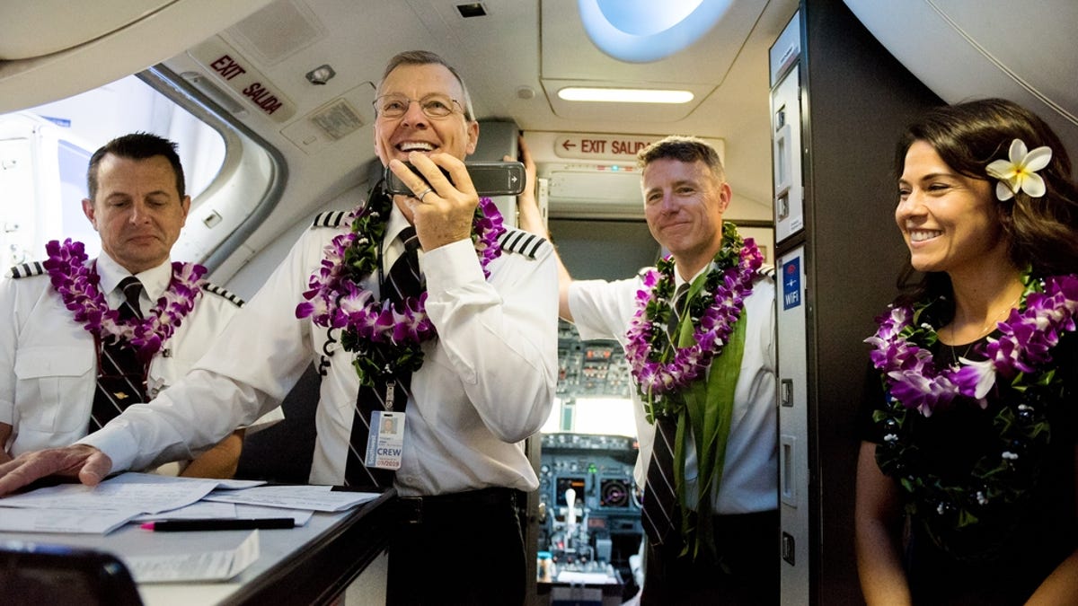 Captain Michael Styer greets passengers on Southwest Airlines' inaugural Hawaiian flight to Honolulu, Hawaii.