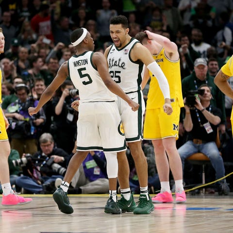 Michigan State's Cassius Winston and Kenny Goins...