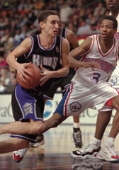 Sacramento Kings Bobby Hurley tries to drive past 76ers Allen Iverson during the first half of Friday, Jan. 24, 1997,  game in Philadelphia. (AP Photo/Rusty Kennedy)