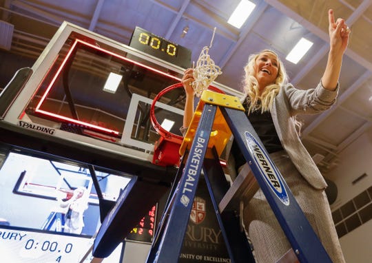 Drury head coach Molly Miller cuts down the net after winning the NCAA Division II Midwest Regional Championship game 51-44 over Grand Valley at the O'Reilly Family Event Center on Monday, March 18, 2019.