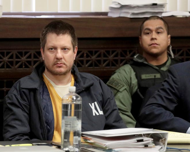 In this Dec. 14, 2018, file photo, former Chicago police Officer Jason Van Dyke, left, appears for a hearing at the Leighton Criminal Court Building, in Chicago.